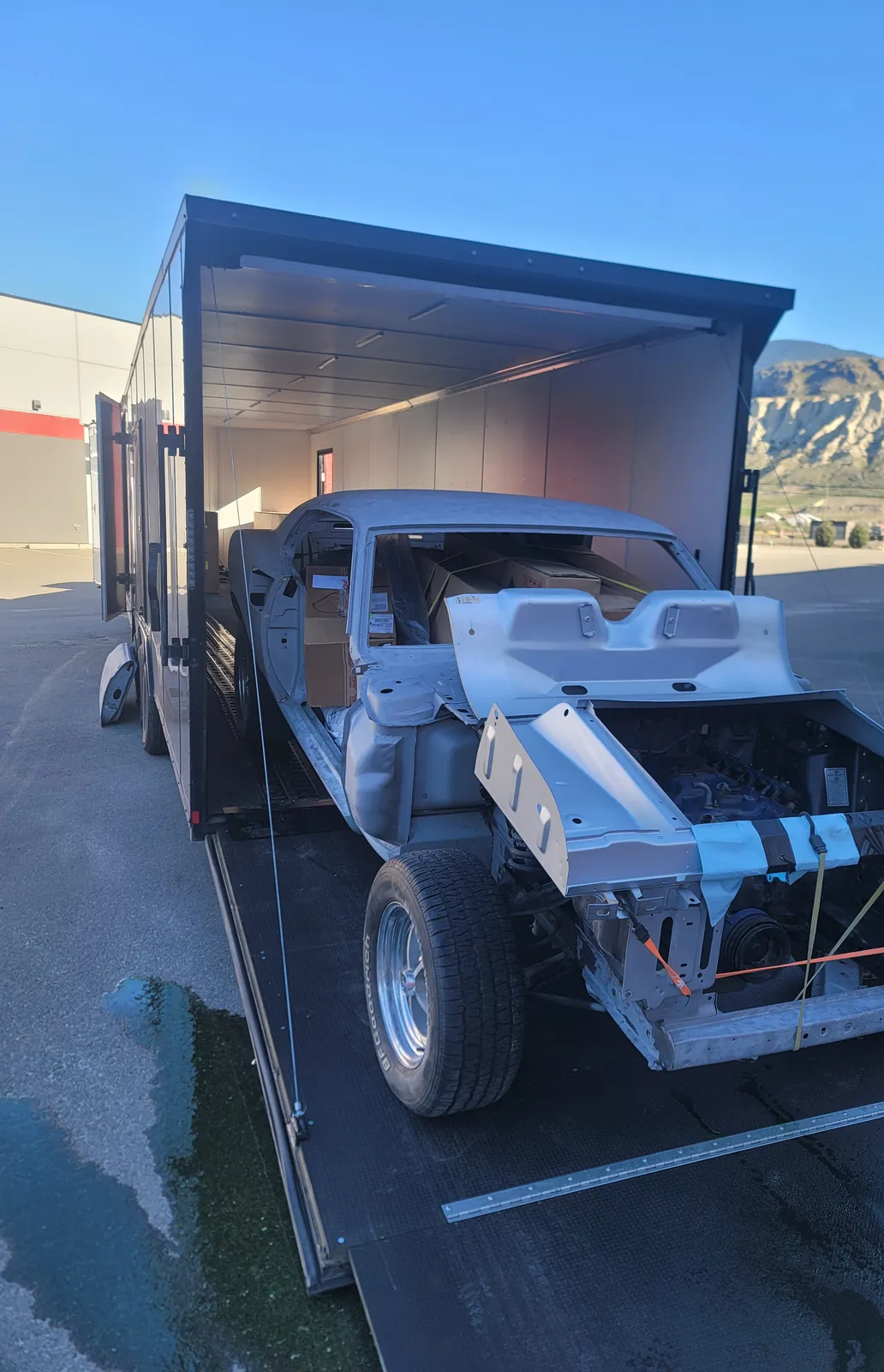 Specialty off-road build loaded into an enclosed trailer.