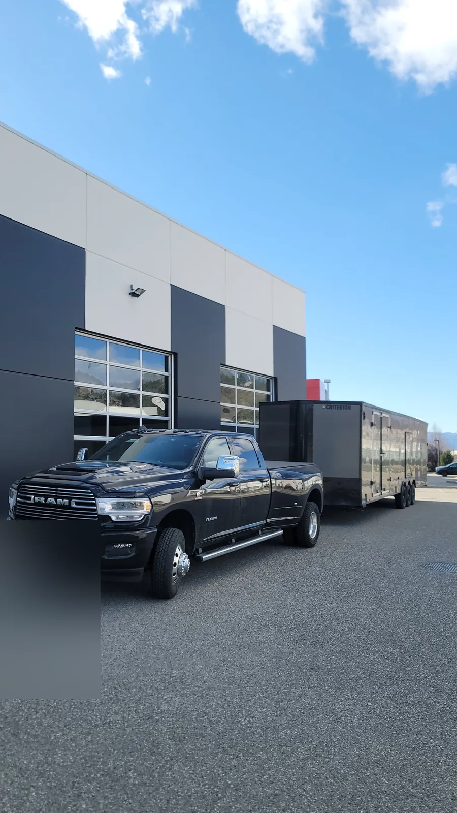 Coast2Coast RAM dually and enclosed trailer staged before a long-distance route.